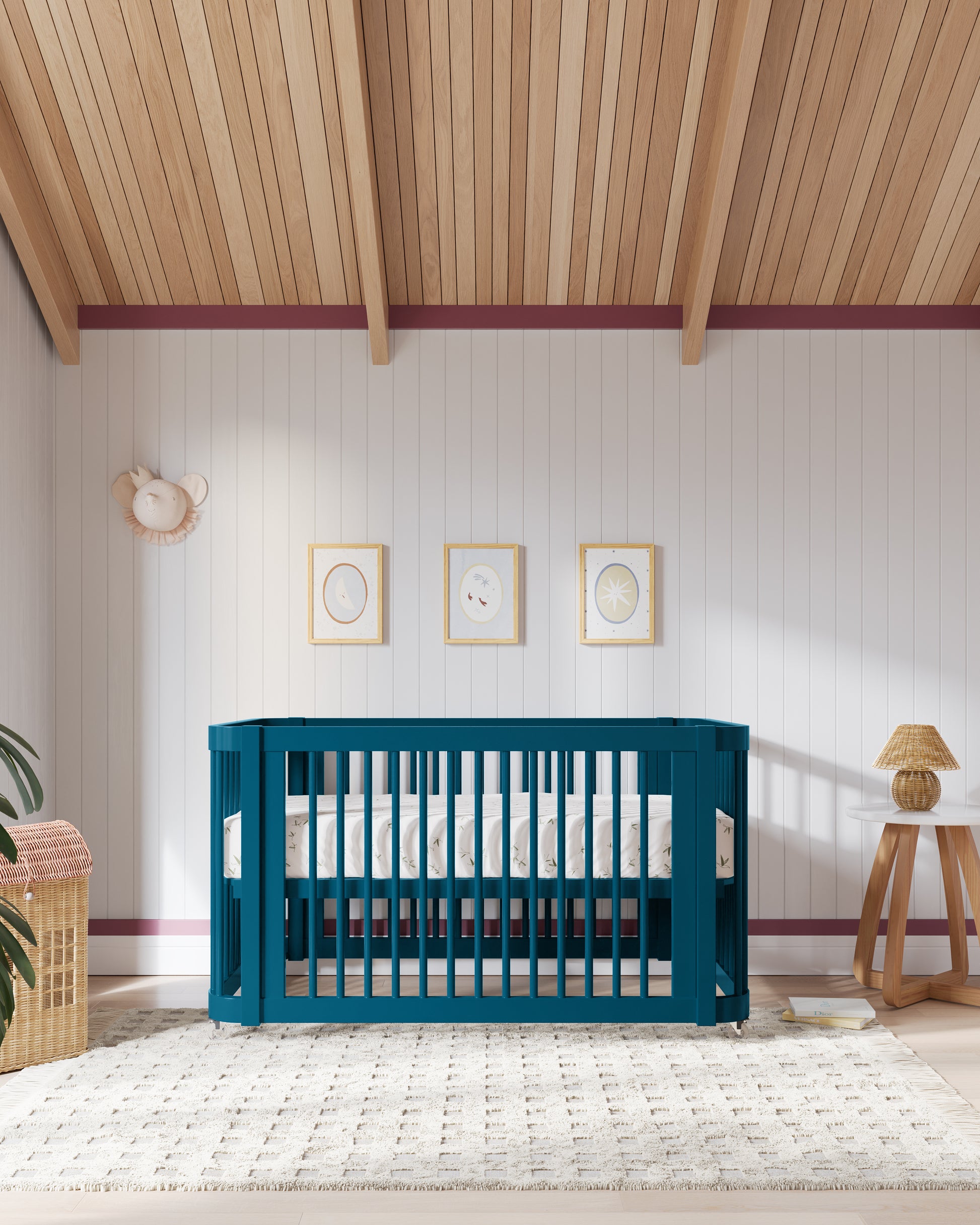 Nursery with a light green crib, wall art, and a cozy ambiance.