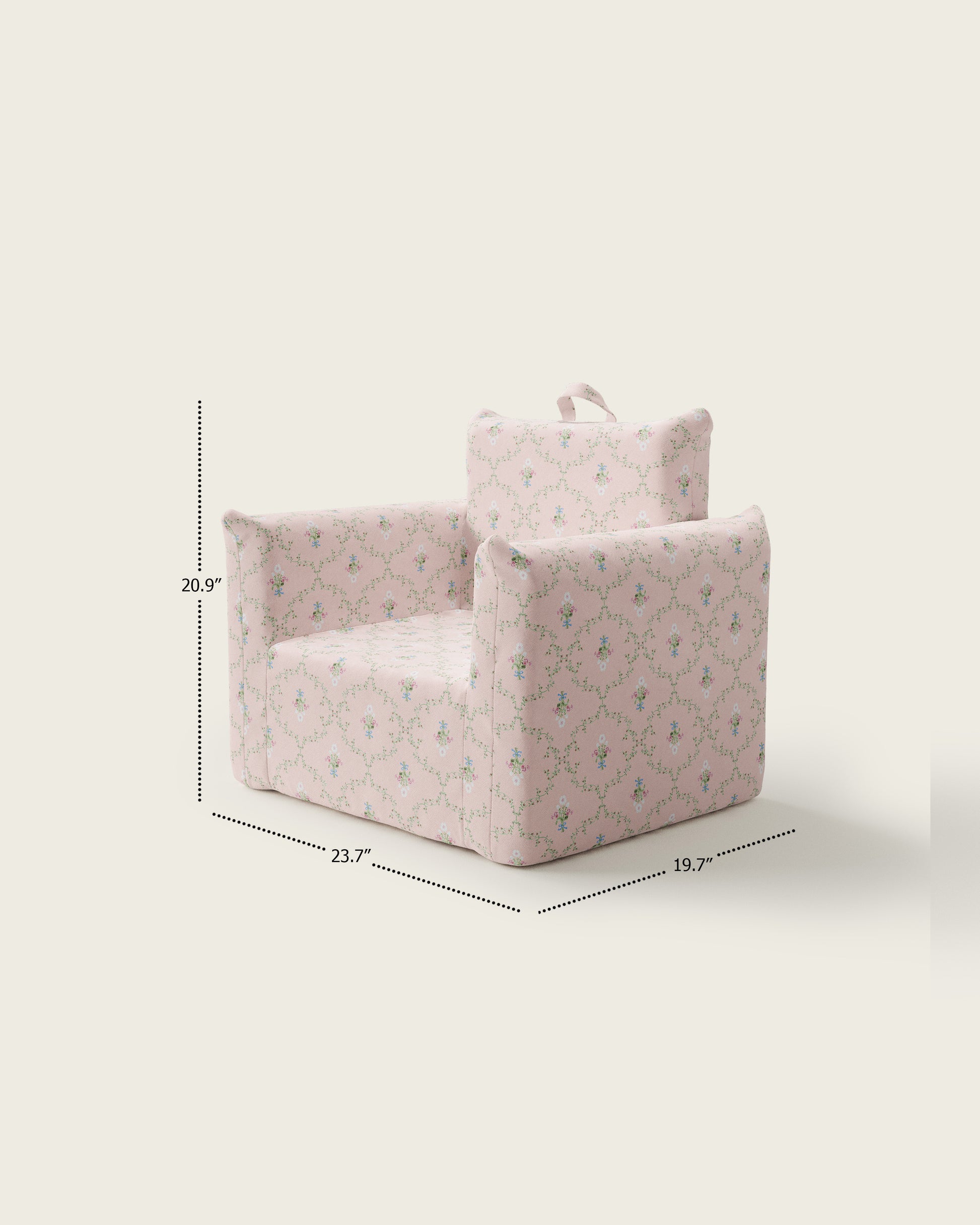 Pink children's armchair with floral pattern, small size, soft fabric, and a handle on top for easy carrying.