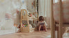 Kid reading a book next to a Nestig shelf